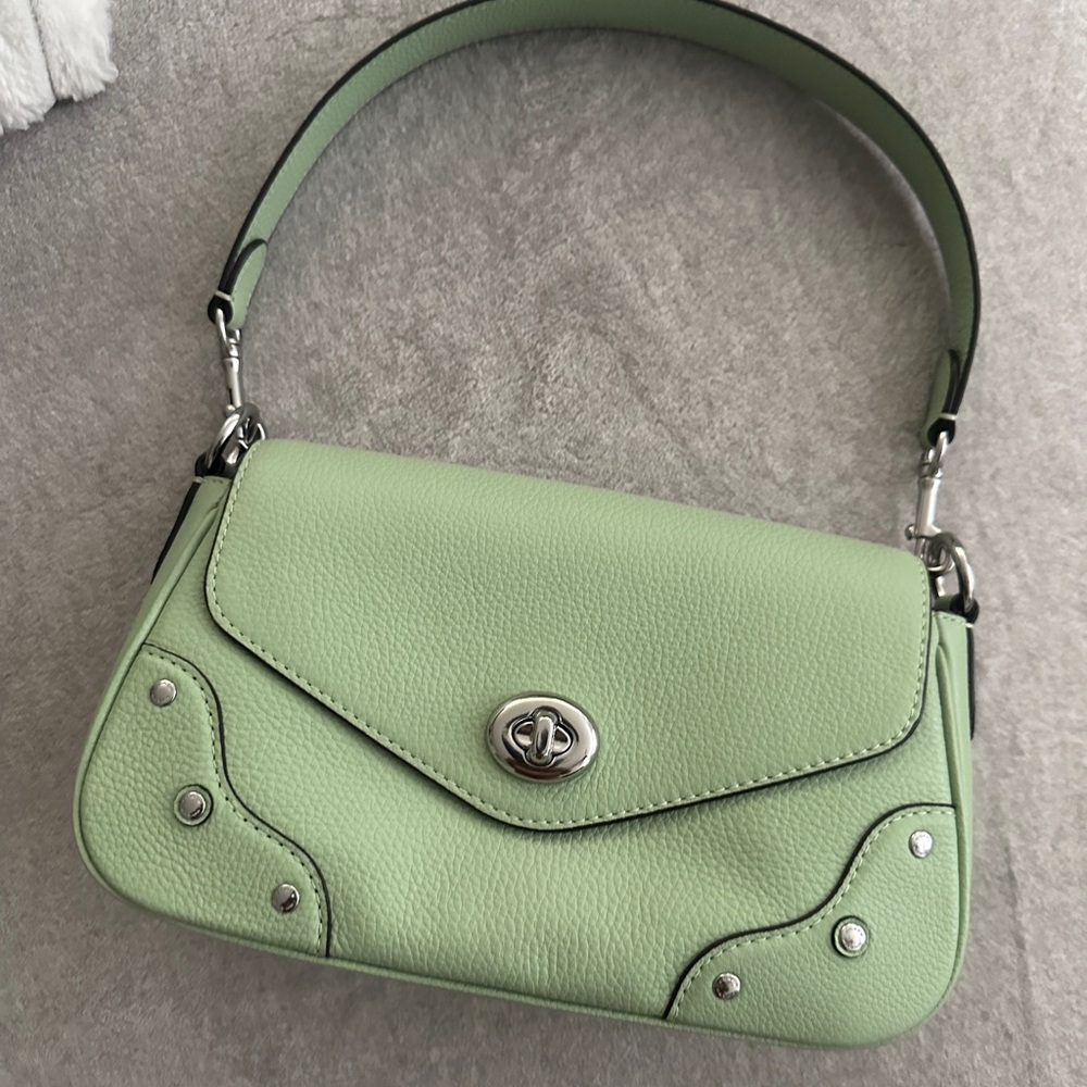 Coach pistachio color bag. Can be made into a crossbody.
